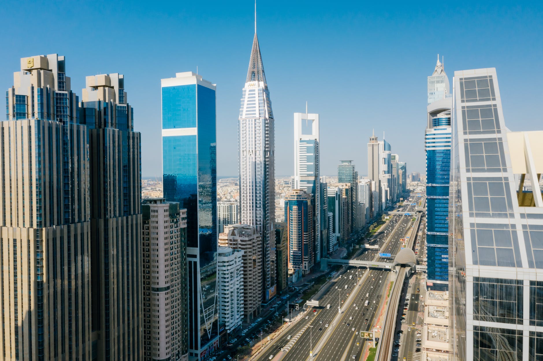 skyscrapers around street in dubai