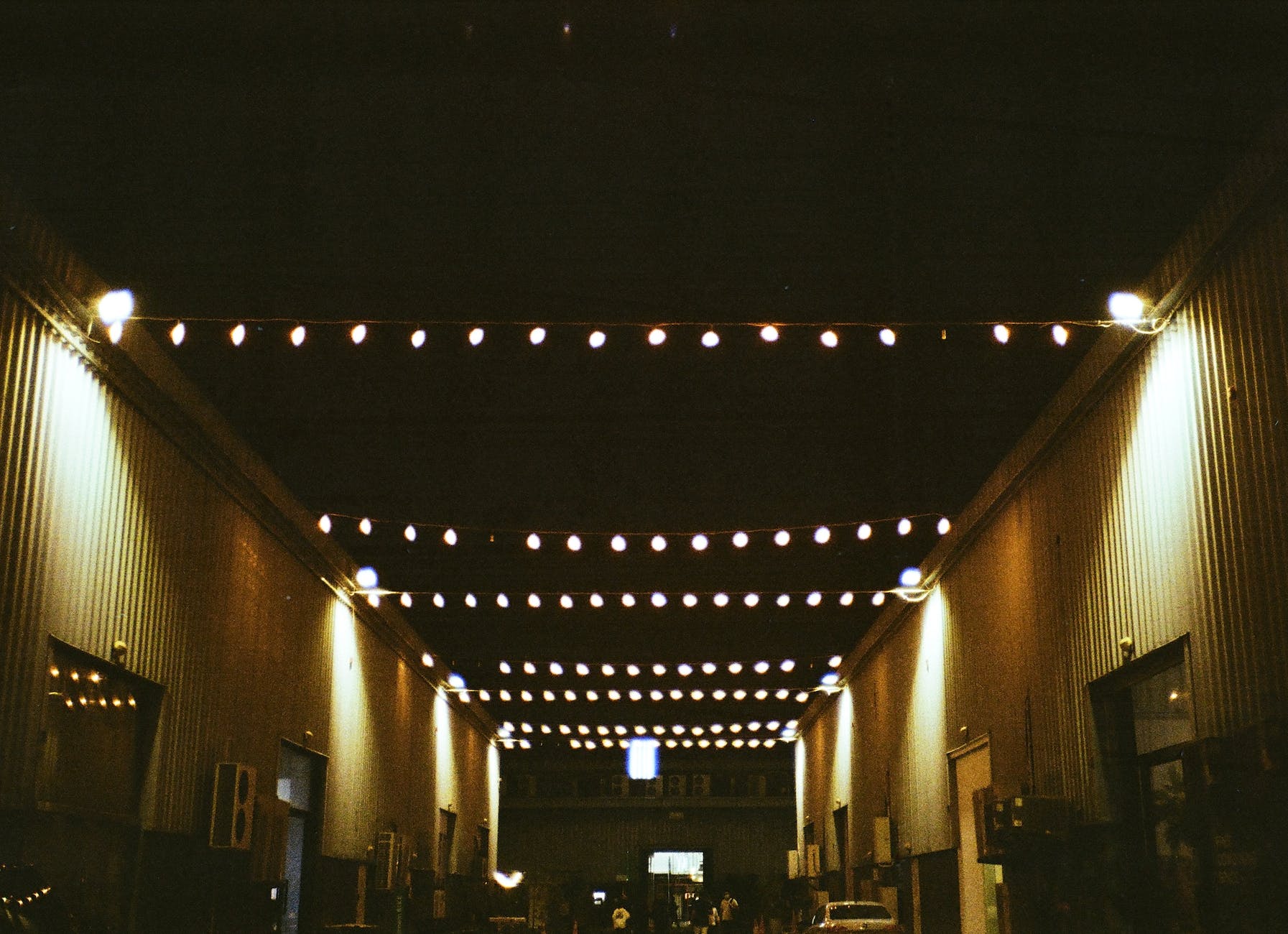 string of lights hanging across the street in alserkal avenue dubai